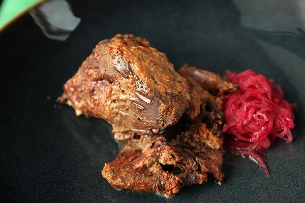 Tandoori pigeon with spiced onions