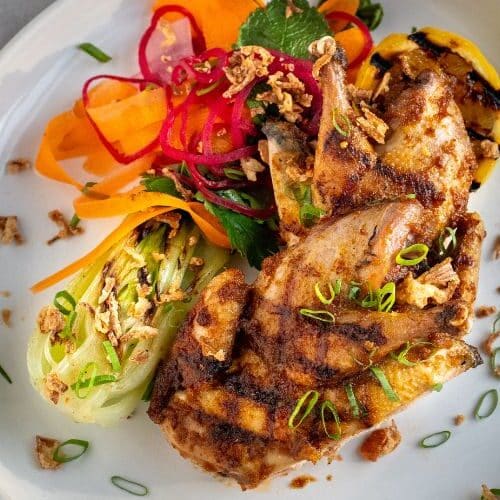 XO partridge with charred bok choy, tangy pickled vegetables and crispy onions